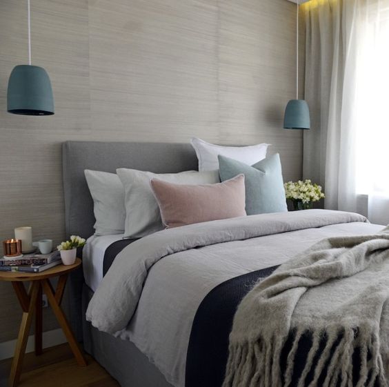 Teal Bell Pendants Add a Pop of Color Beside Bed
