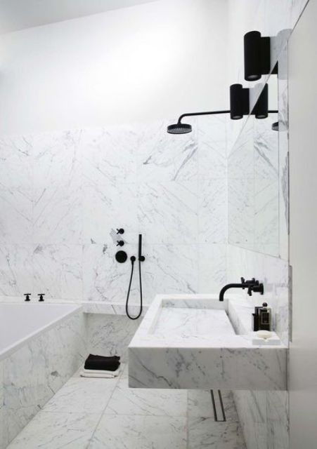 Black Fixtures Add Sharp Contrast to Marble Surfaces