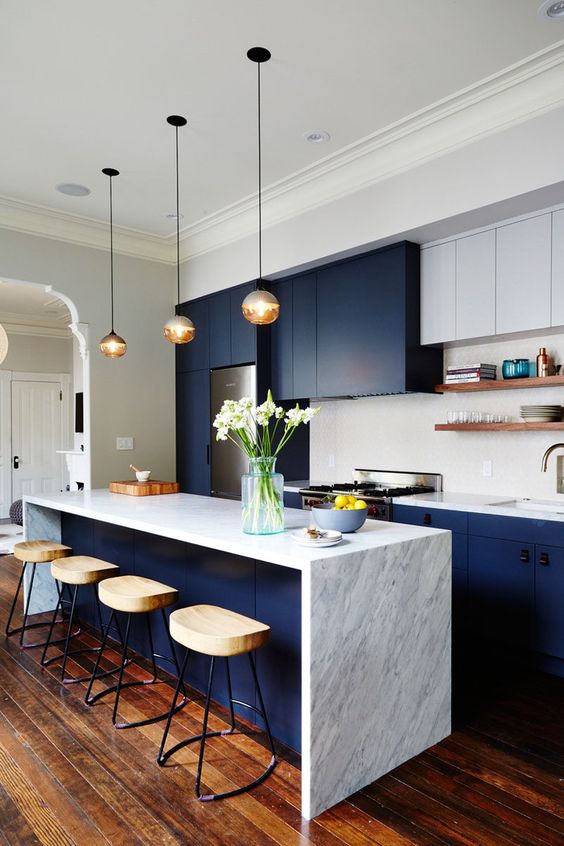 Glass Globe Pendant Lights Add Warm Ambiance Over Island