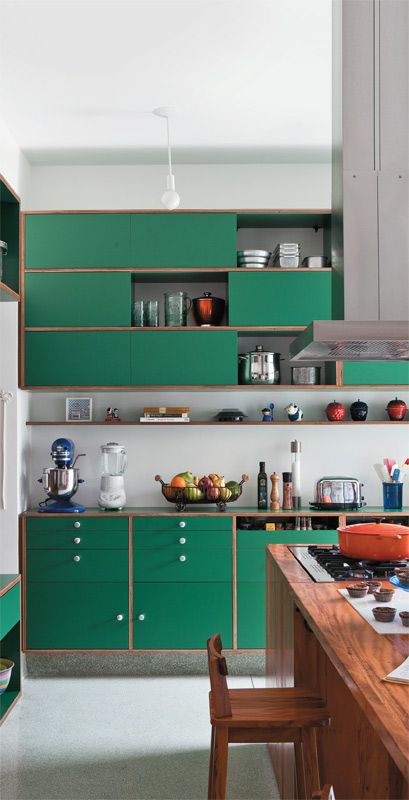 Green Cabinetry With Natural Wood Trim Accents