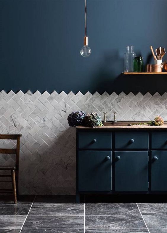 Herringbone Marble Tiles Create a Textured Wall Statement