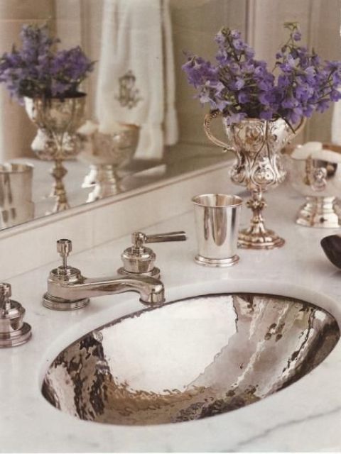 Ornate Silver Trophies Holding Purple Flowers