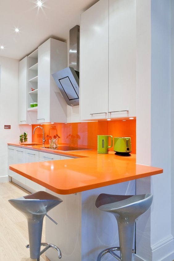 Orange Countertop Extends Into Breakfast Bar Seating