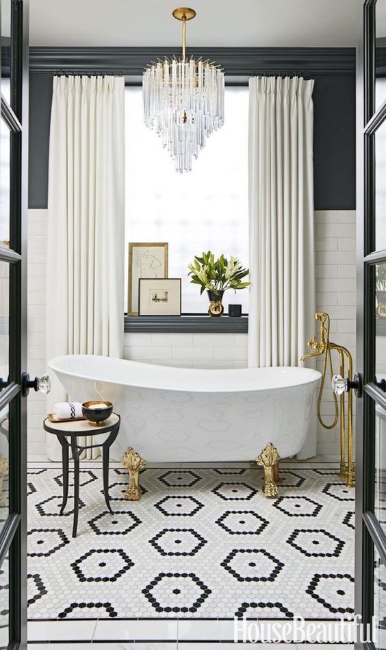 Crystal Chandelier Adds Glamour Above Freestanding Tub