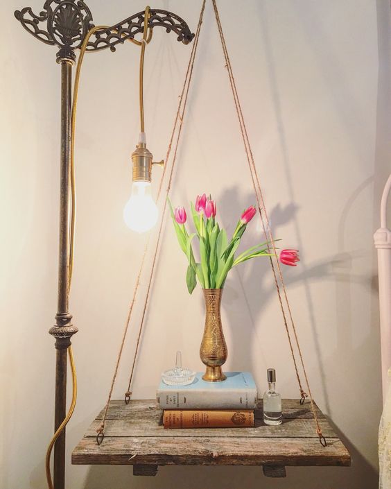 Rustic Plank Shelf Hung by Twine With a Vintage Lamp