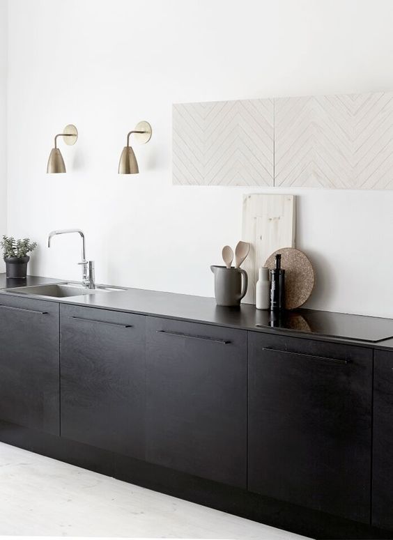 Brass Wall Sconces Add Warm Accents Above Sink