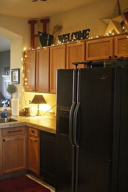 Warmth Above Kitchen Cabinets with String Lights