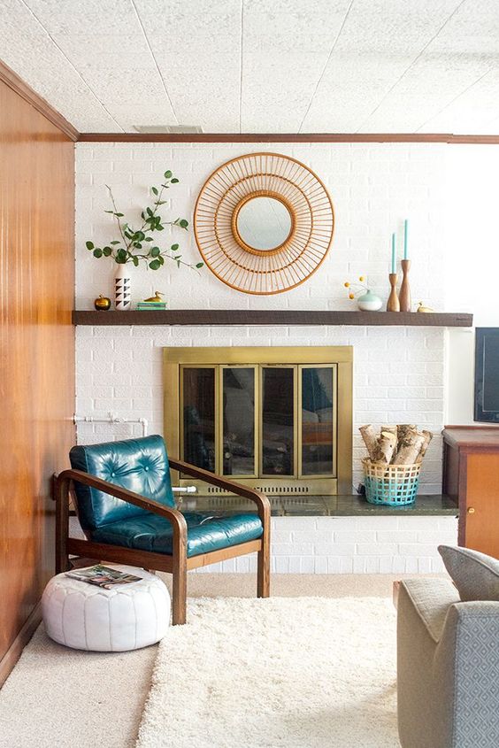Round Rattan Mirror Adds Natural Texture Above the Fireplace