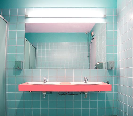 Floating Coral Vanity With Double Sinks Adds a Bold Pop