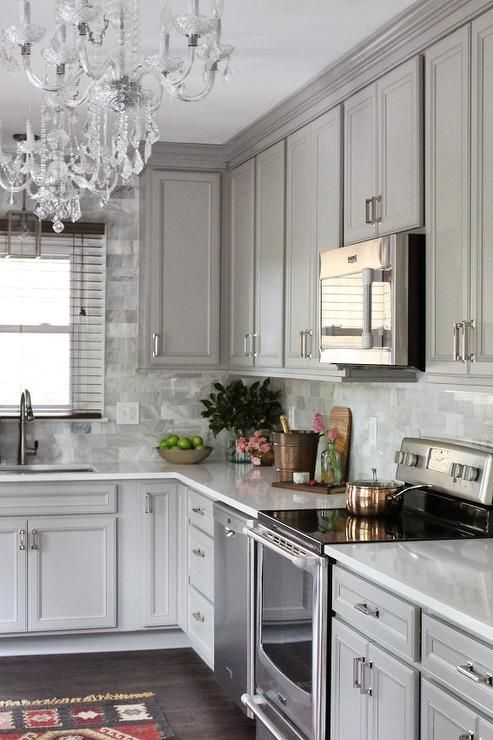 Marble Backsplash With Contrasting Copper Accents