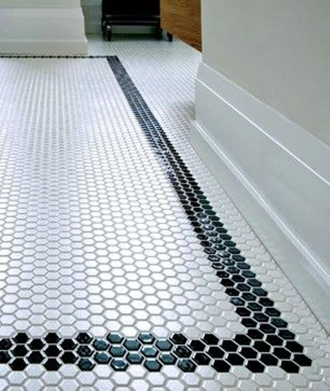 Black Hexagon Tile Borders Define a White Hexagon Floor