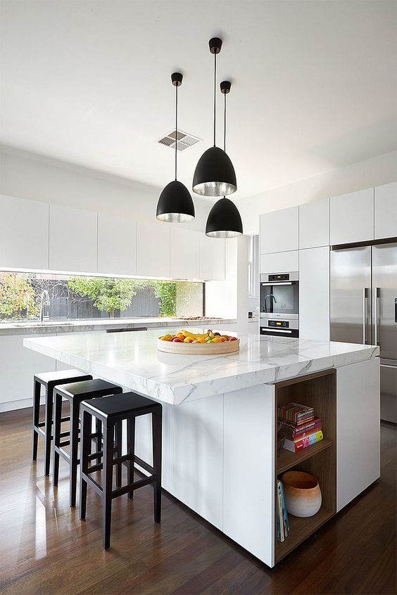 Open Shelving Integrates Warm Wood Into White Island Base