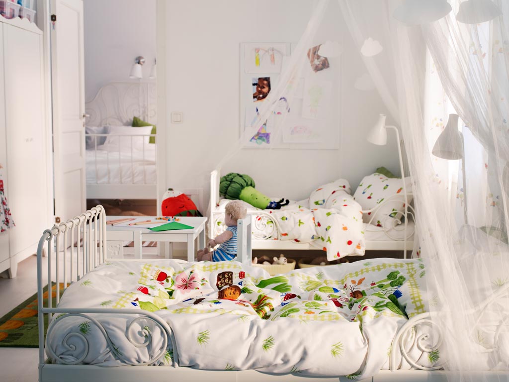 White Metal Beds With Whimsical Botanical Bedding