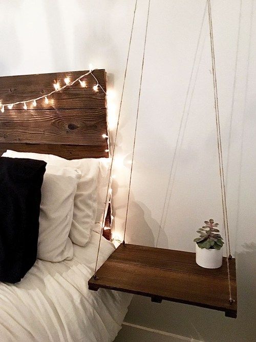 Dark Wood Plank Shelf Hung by Thin Twine