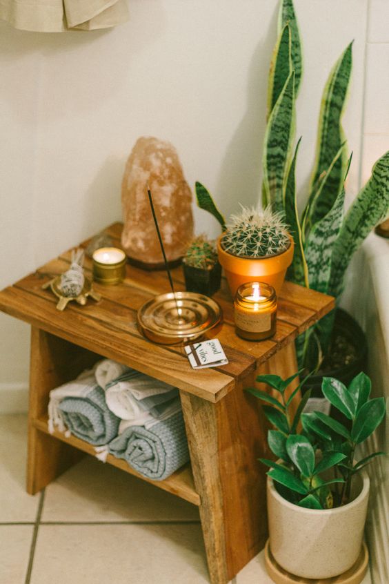Wooden Stool with Rolled Towels and Plants