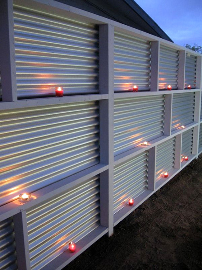 Recessed Shelves in Metal Panels Hold Tealight Candles
