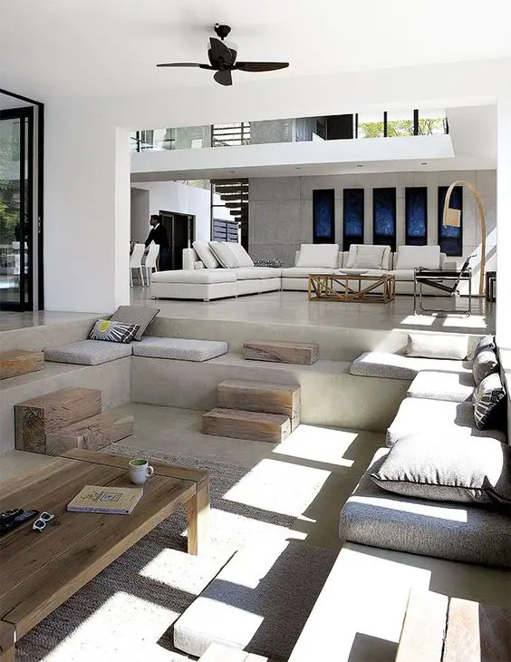 Tiered Concrete Seating with Wooden Blocks as Tables