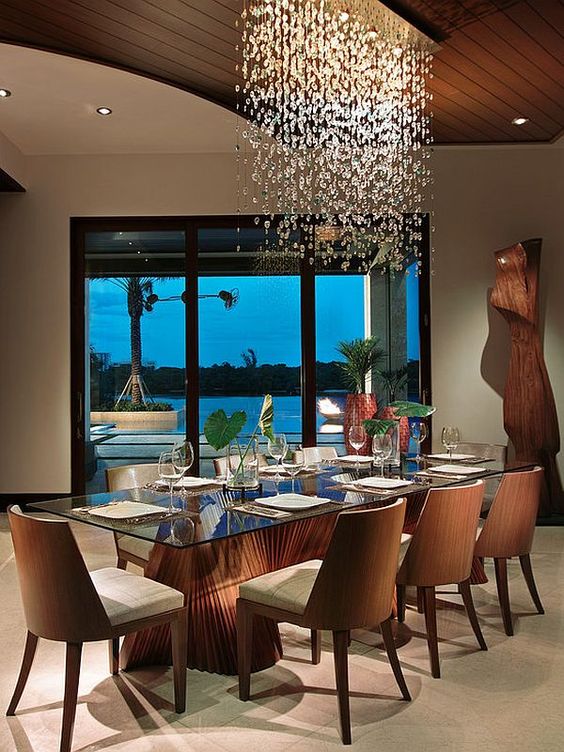 Glass Tabletop Showcases Sculptural Wood Dining Table Base
