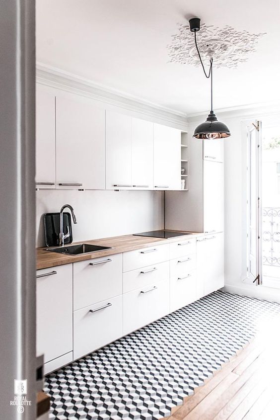 Ground Your White Kitchen with Black and White Geometric Floor Tiles
