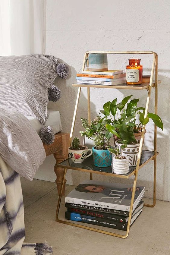 Tiered Gold Shelf Adds Greenery and Books