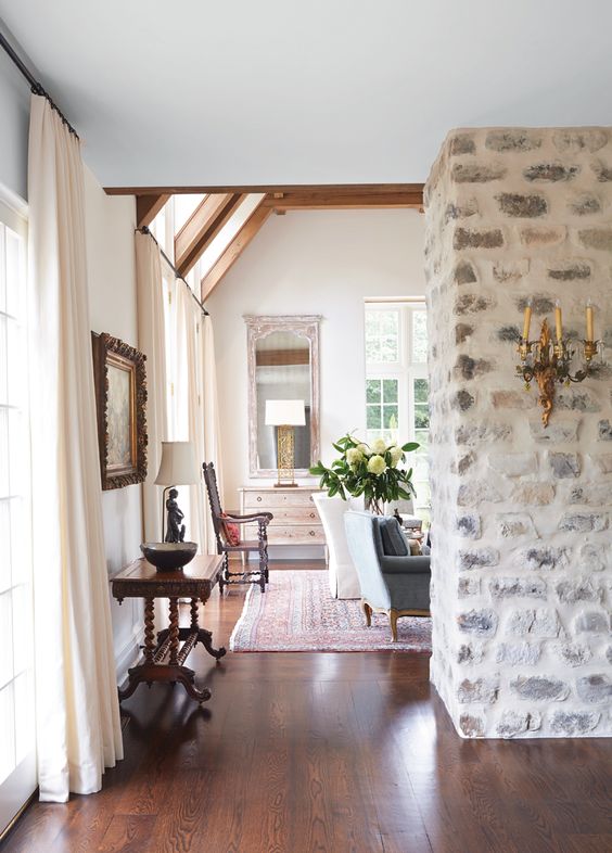 Ornate Wall Sconce Adds Antique Charm to Stone