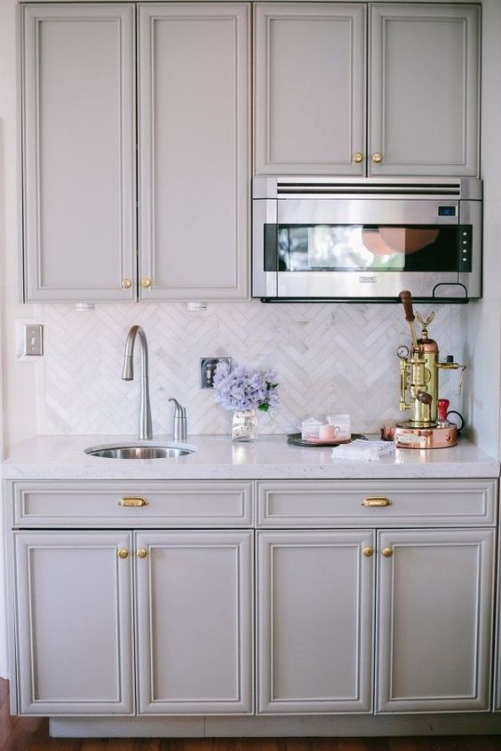Gold Espresso Machine Adds Warmth to Marble Countertop
