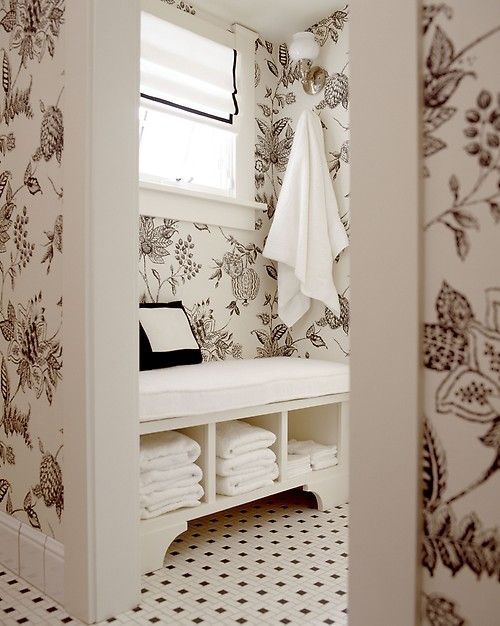 White Bench With Open Shelves for Storing Folded Towels