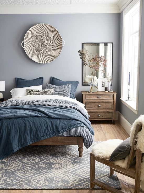 Woven Wall Basket Adds Natural Texture Above the Bed