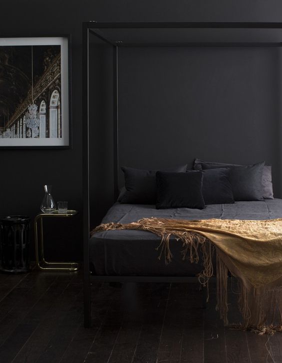 Gold Fringe Throw Adds Warmth to a Dark Bed