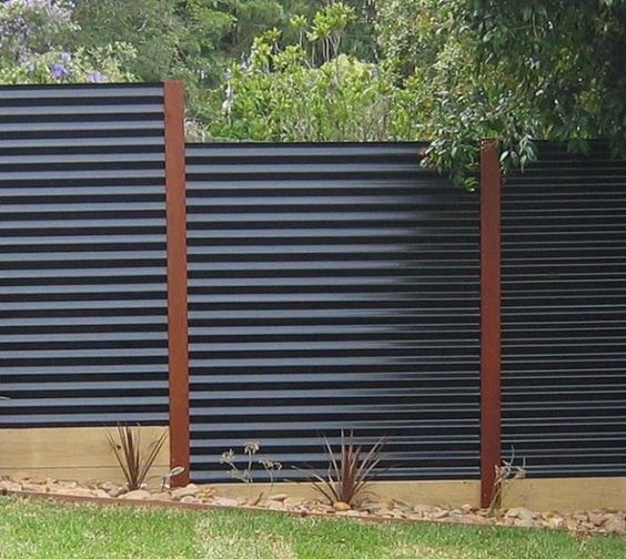 Corrugated Metal Fencing with Warm Wood Posts