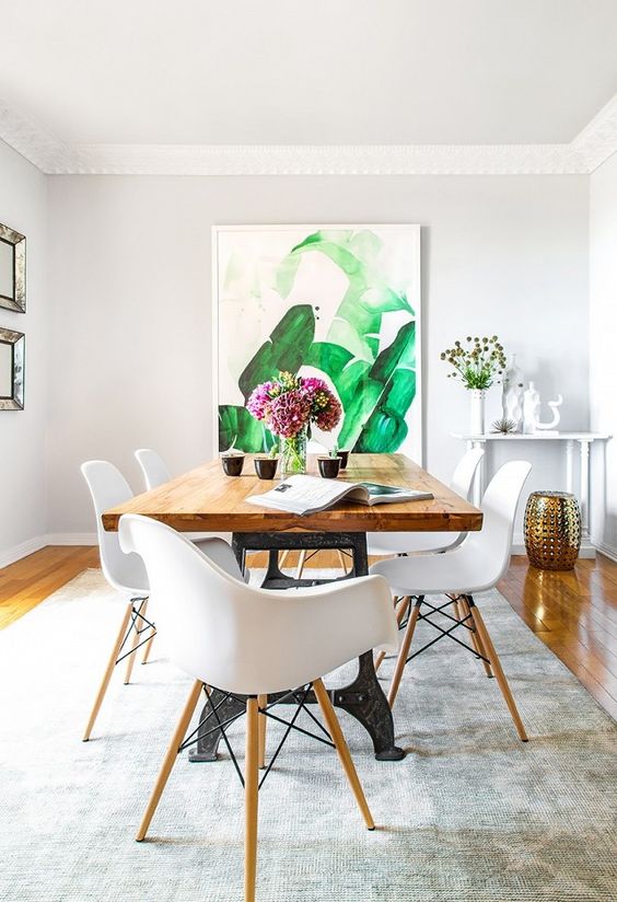Large Botanical Artwork Anchors a Dining Space