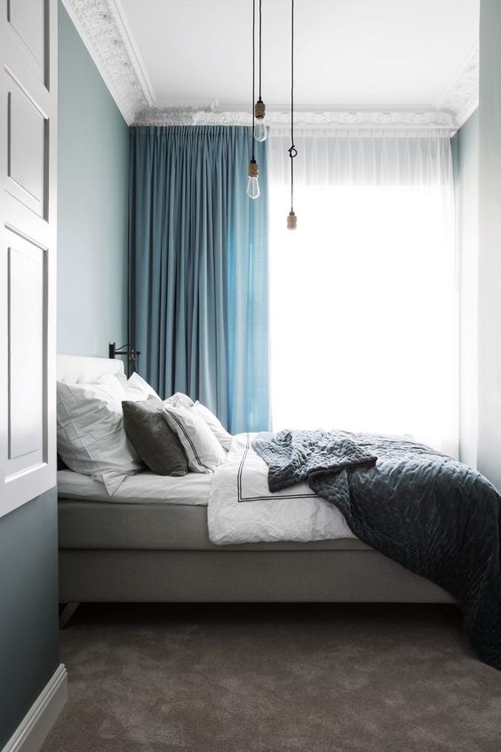 Pendant Lights Add Industrial Charm Above the Bed