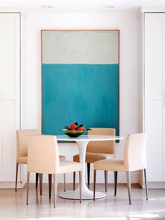 Large Abstract Artwork Anchors a Dining Space