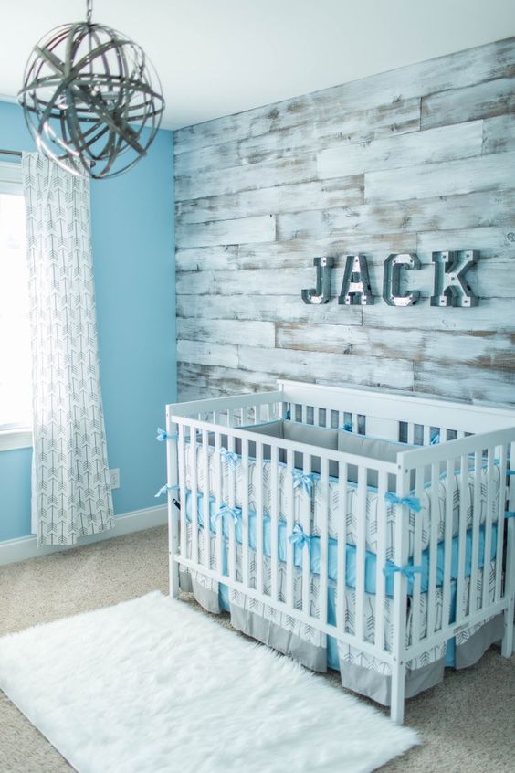 Metal Block Letters Spell Out a Name on Wood Wall