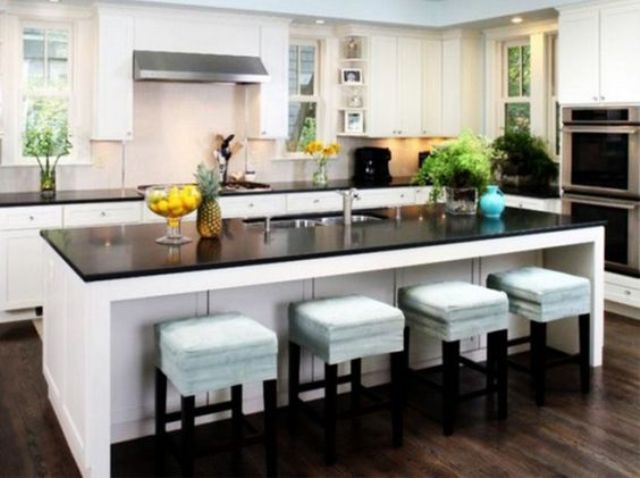 Square Stools With Light Blue Upholstery Add Softness to Island Seating