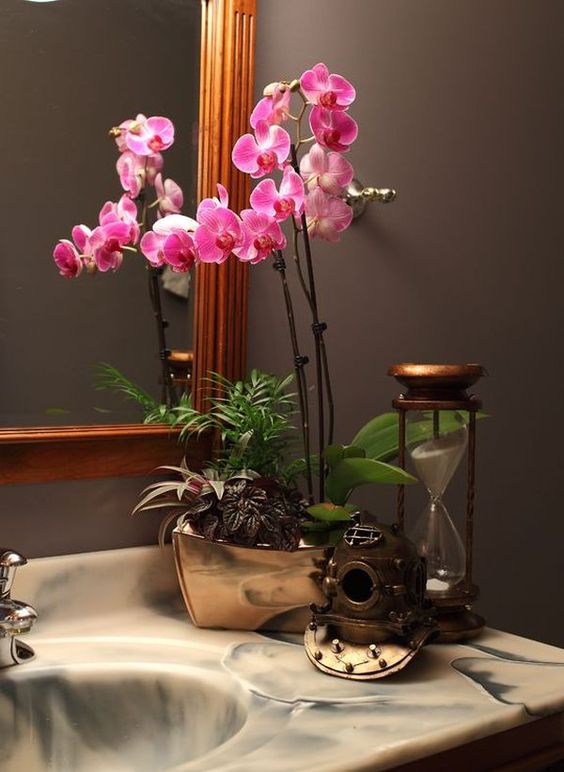 Orchid Arrangement With Vintage Diving Helmet and Hourglass