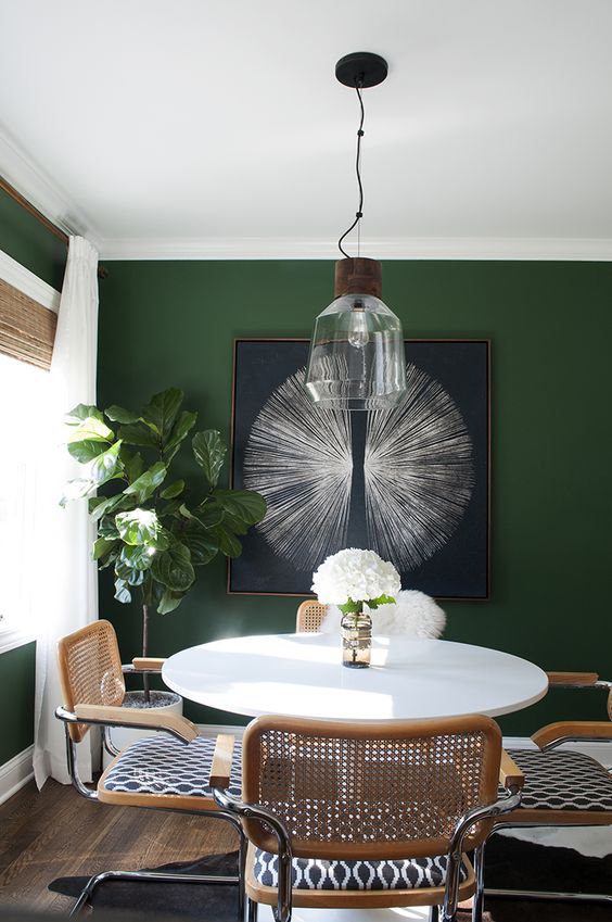 Large Starburst Artwork Anchors a Dining Space