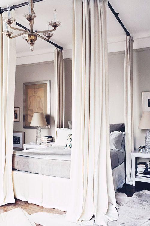 Soften a Four-Poster Bed Frame with Creamy Drapes