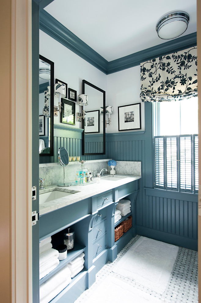 Blue Paneled Walls Frame a Double Vanity With Open Shelving