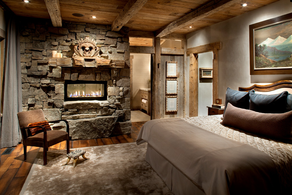 Anchor Your Room with a Stone Fireplace and Carved Wood Mantle