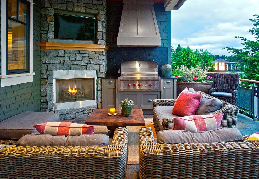 Stone Fireplace With Integrated Television and Grill Station