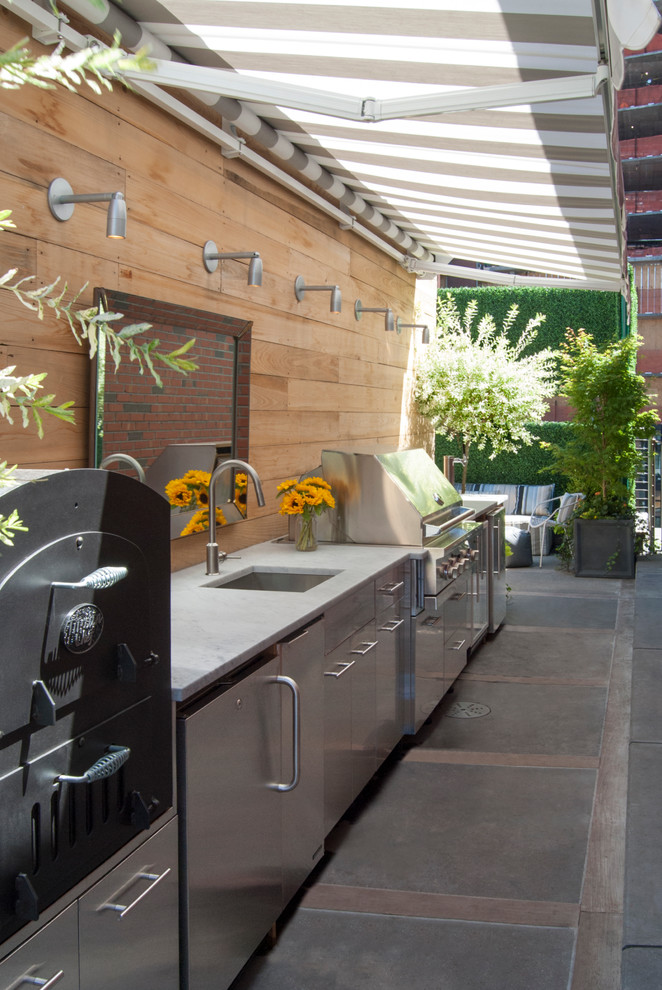 Modern Outdoor Kitchen With Integrated Sink and Stainless Steel Cabinetry