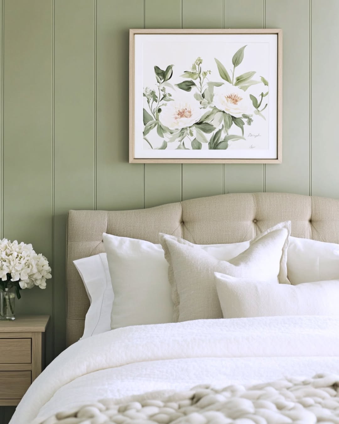 Framed Botanical Art Adds Soft Floral Detail Above Tufted Headboard