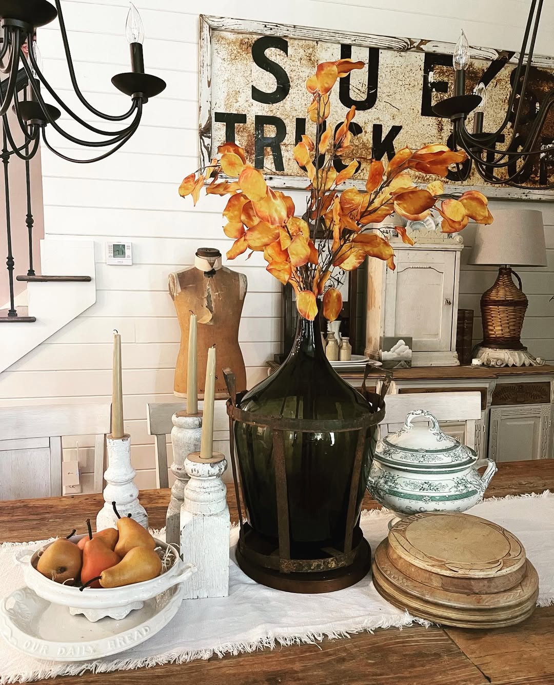 Tall Amber Branches Add Fall Color To A Dark Glass Vase