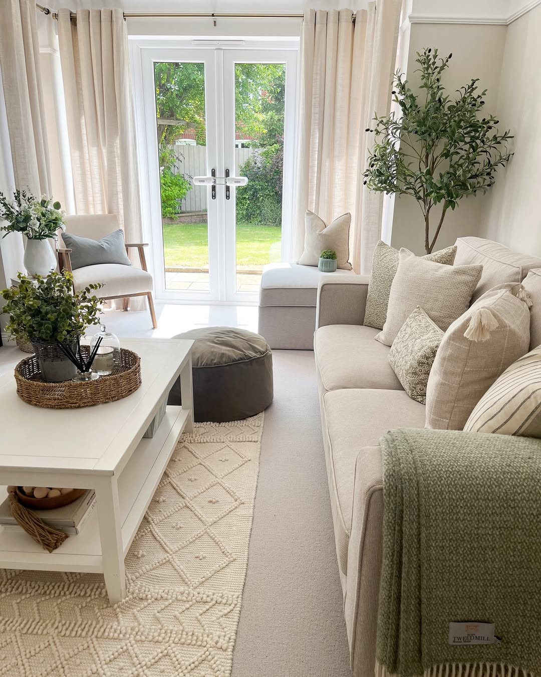 Woven Tray Holds Diffuser and Greenery on Coffee Table