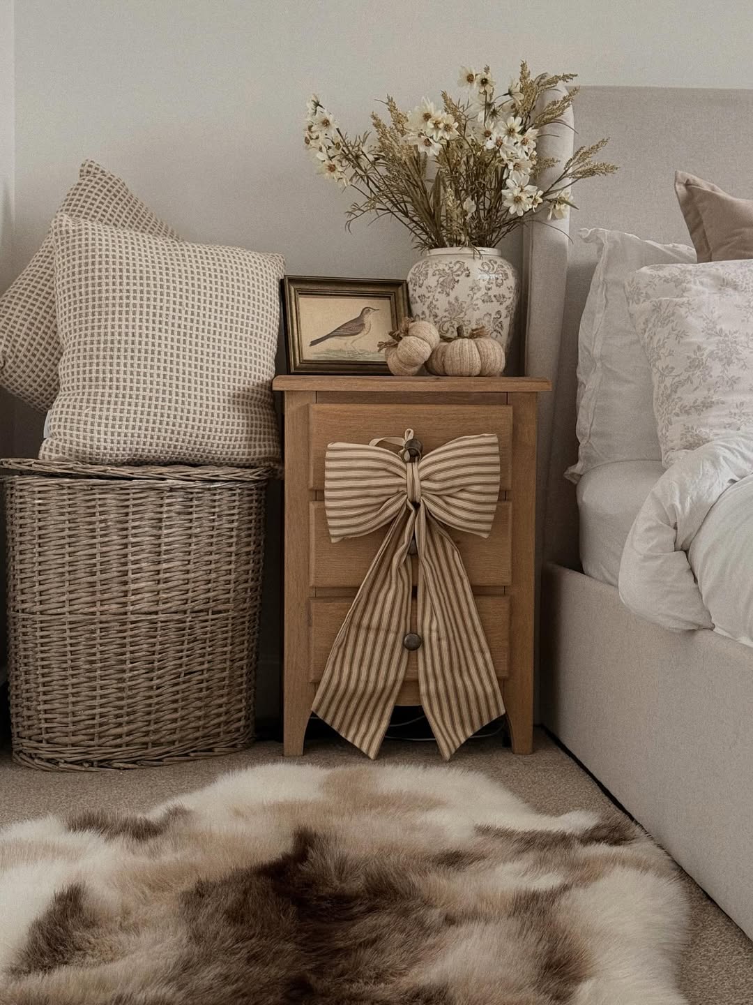 Wooden Nightstand With A Large Striped Bow Accent