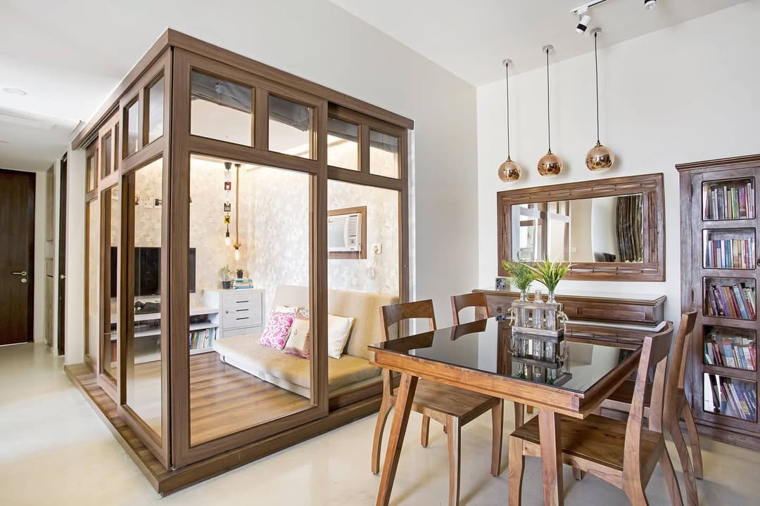 Glass Enclosed Nook Creates a Cozy Retreat Within an Open Space
