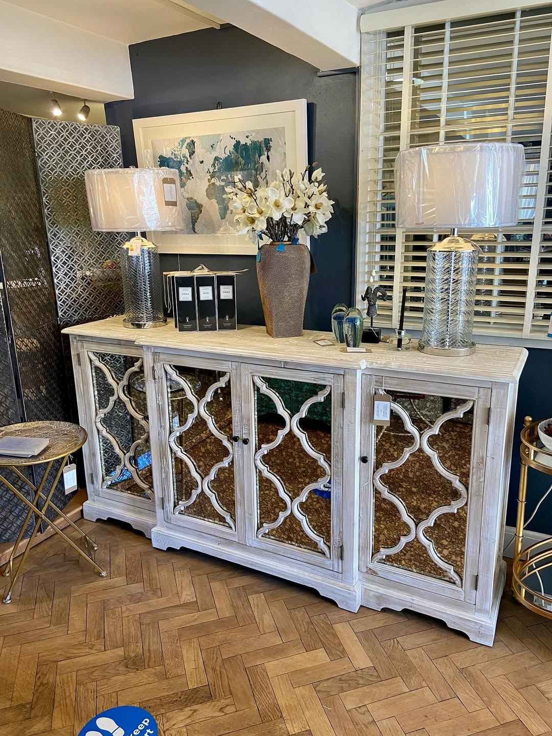 Distressed White Sideboard With Mirrored Trellis Doors