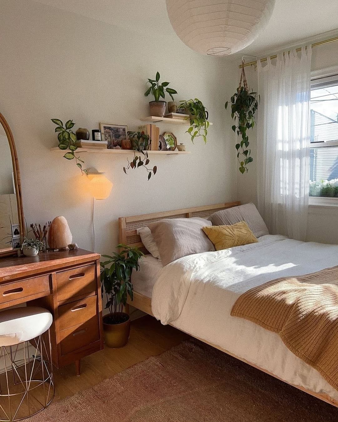 Two-Tiered Shelves Display Plants and Decor Above Bed