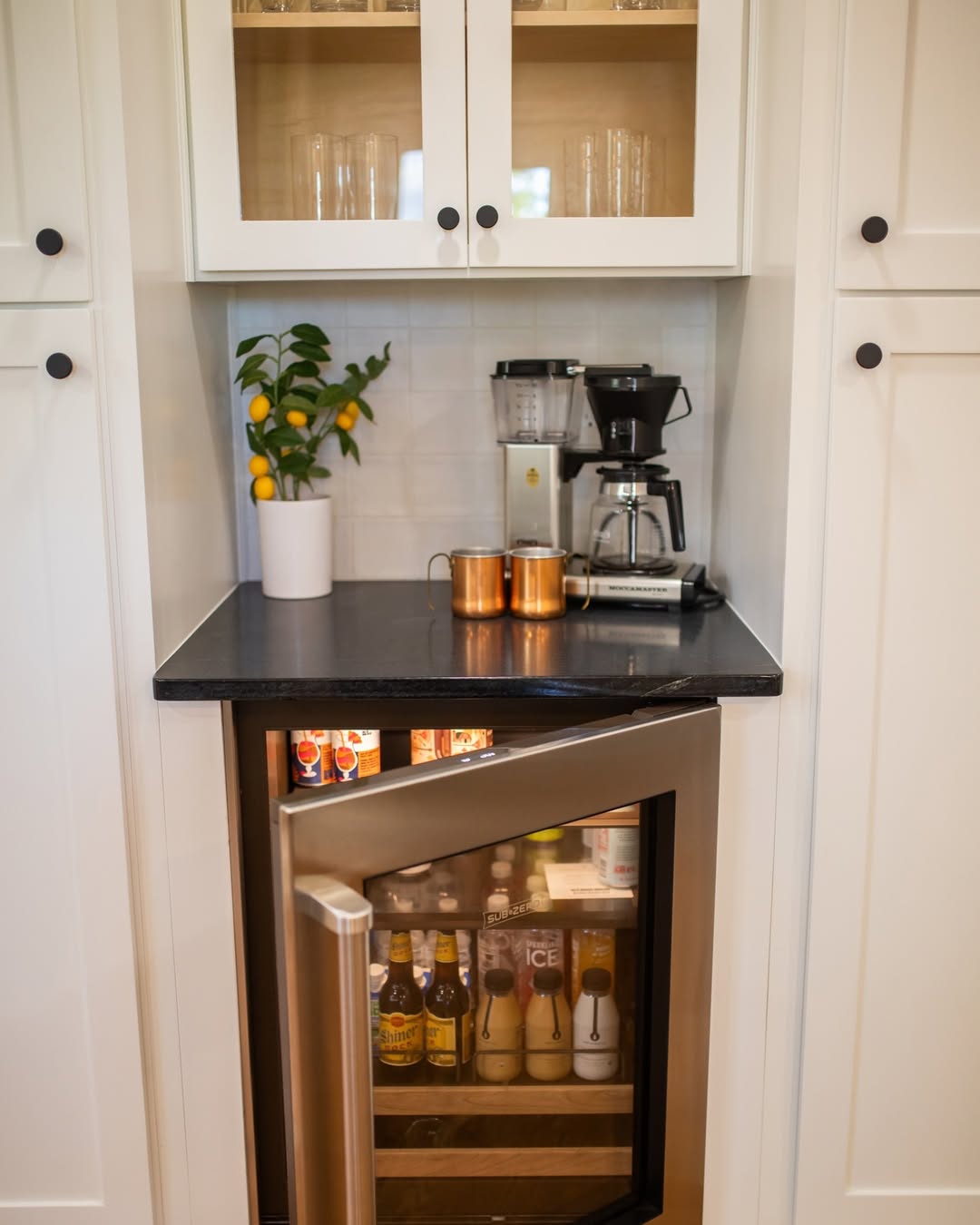 Small Refrigerator Keeps Coffee Bar Drinks Chilled